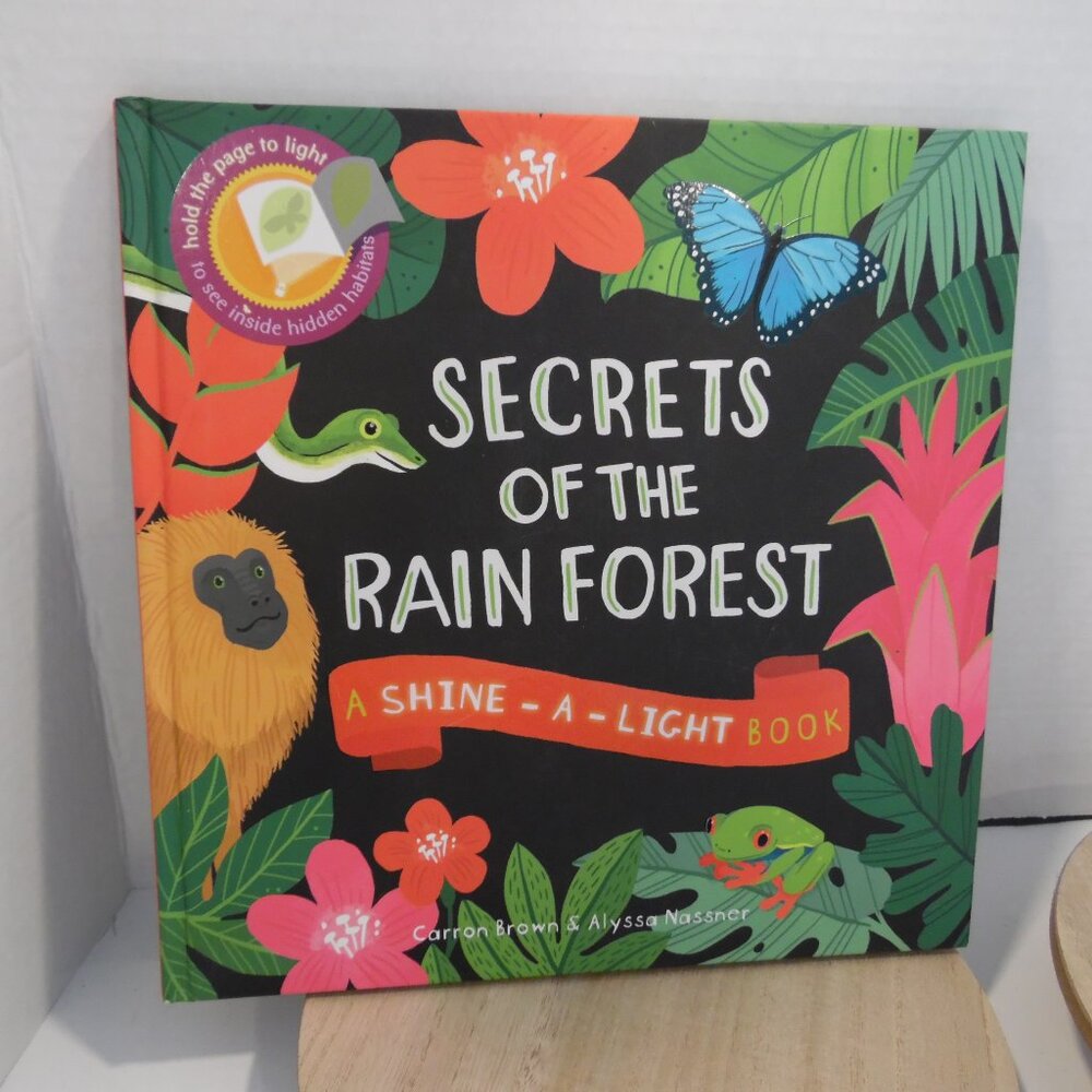 Secrets of The Rainforest A Shine-A-Light Book Explore the mystery in the pages
